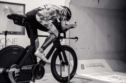 Kieran Lindars in racing position on a bike during a speed test, showcasing the Absolute Speed Behind Saddle Hydration.