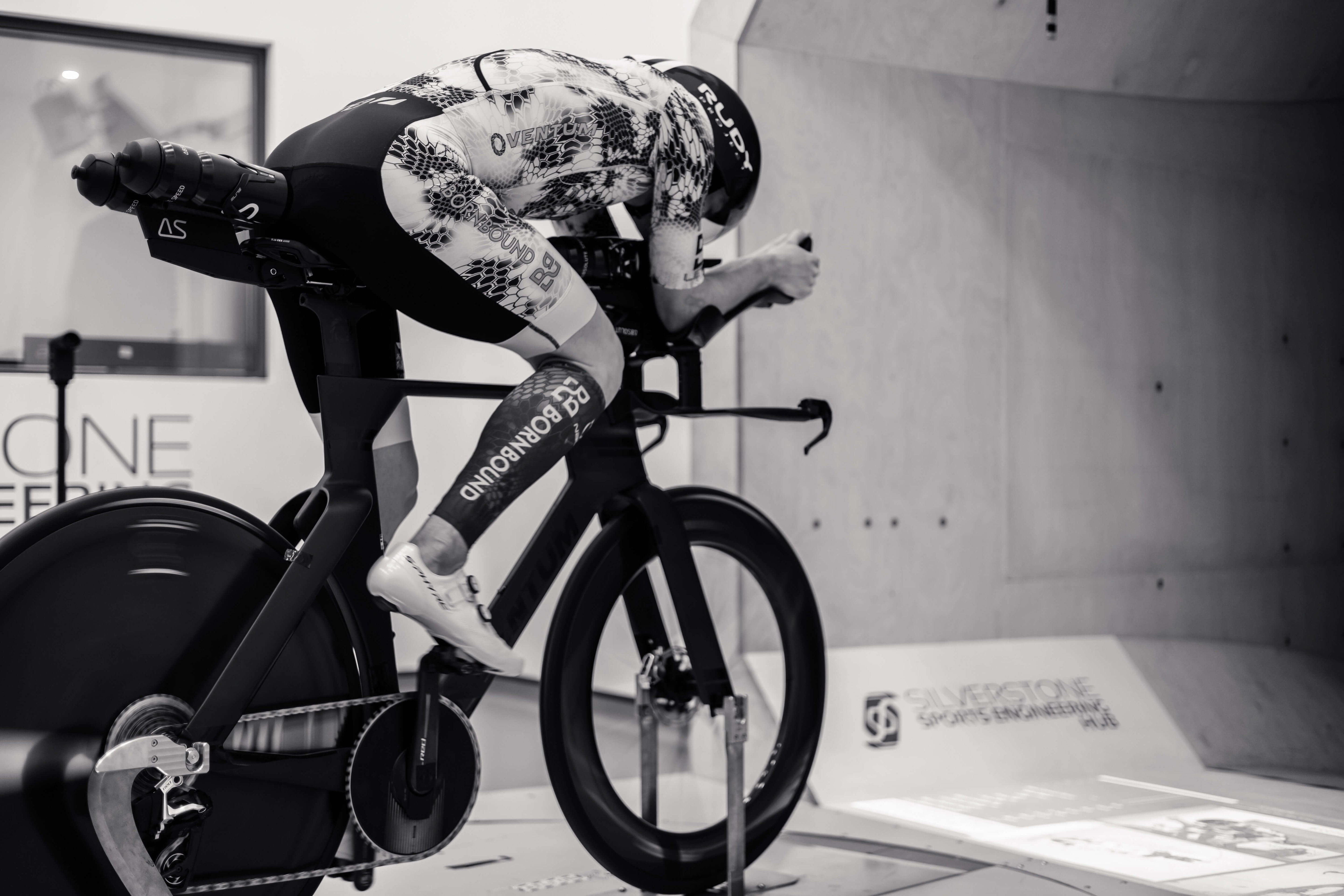 Kieran Lindars in racing position on a bike during a speed test, showcasing the Absolute Speed Behind Saddle Hydration.